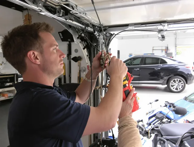 Whitman Garage Door Repair safety certified technician performing cable replacement in Whitman