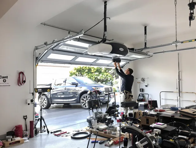 Whitman Garage Door Repair specialist installing smart garage door opener system in Whitman home