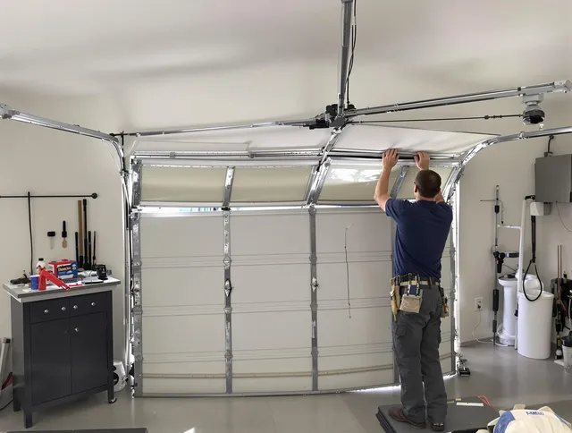 Whitman Garage Door Repair specialist performing precise section replacement on Whitman garage door