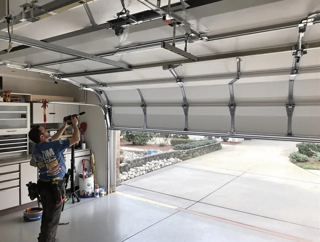 Garage door track repair service by Whitman Garage Door Repair in Whitman